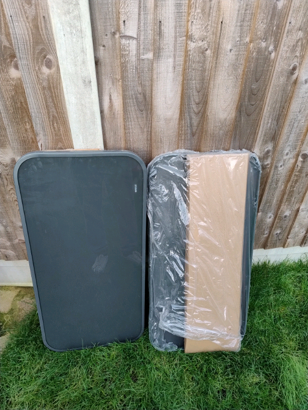 Two glass garden tables 