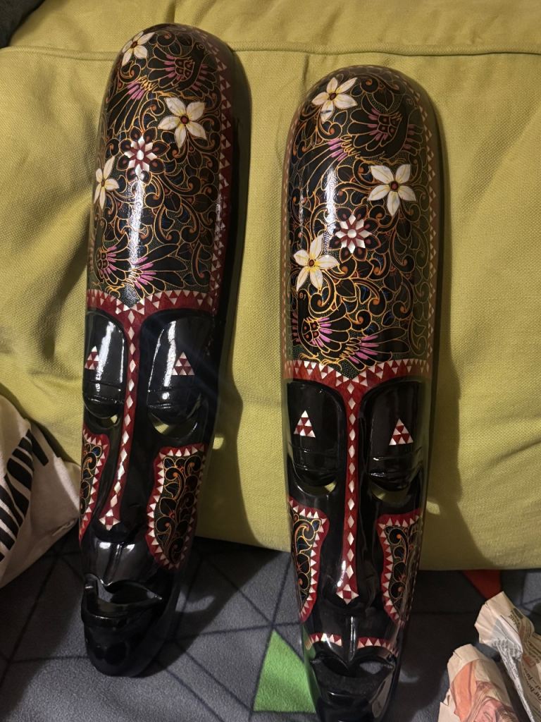 Wooden bali faces wall art and shelves 