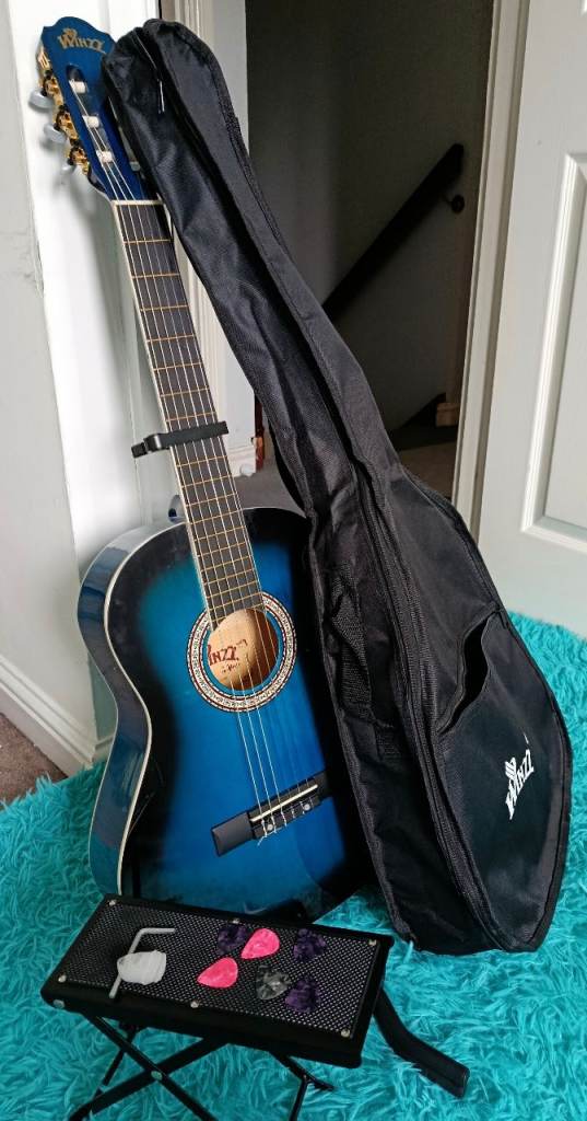 3/4 Classical Guitar with bag, picks, foot stand.