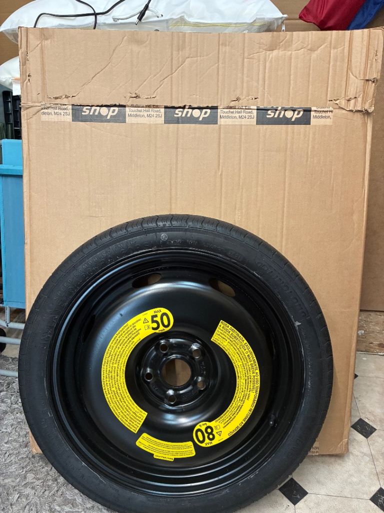 Brand new spare wheel and jack.
