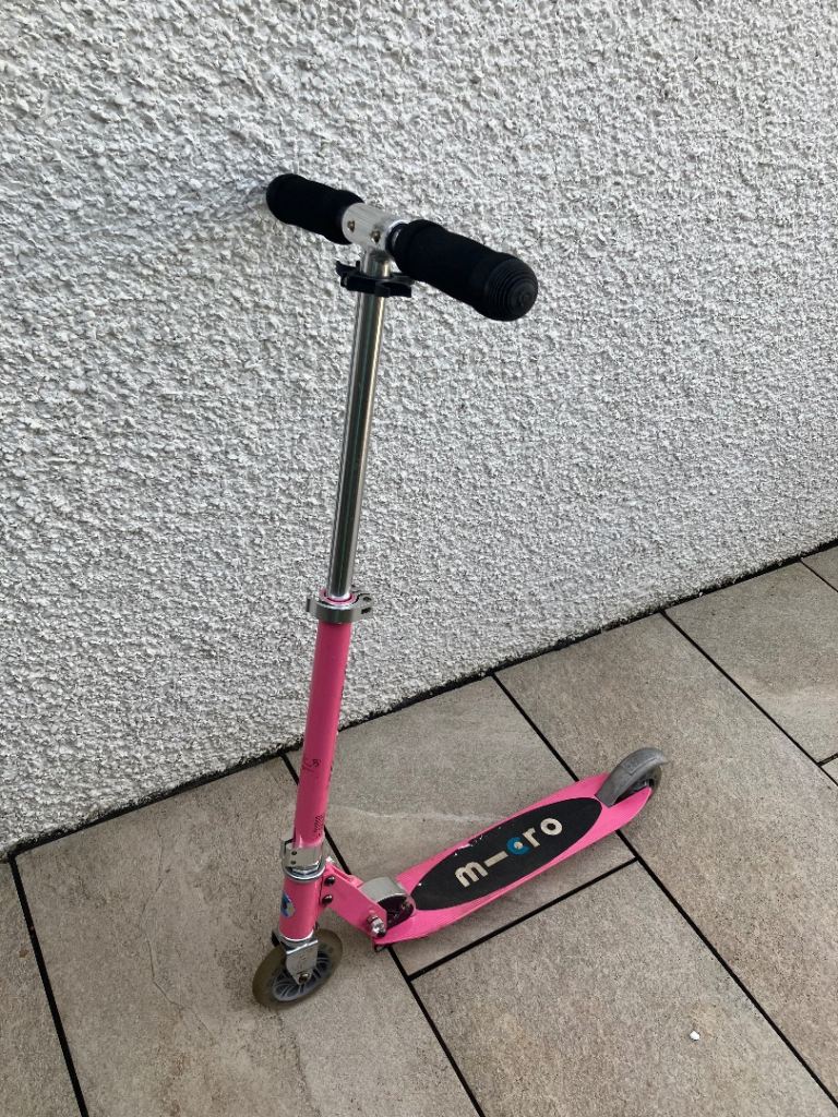 Pink light up wheels metal chassis micro scooter with adjustable handbag and folds.