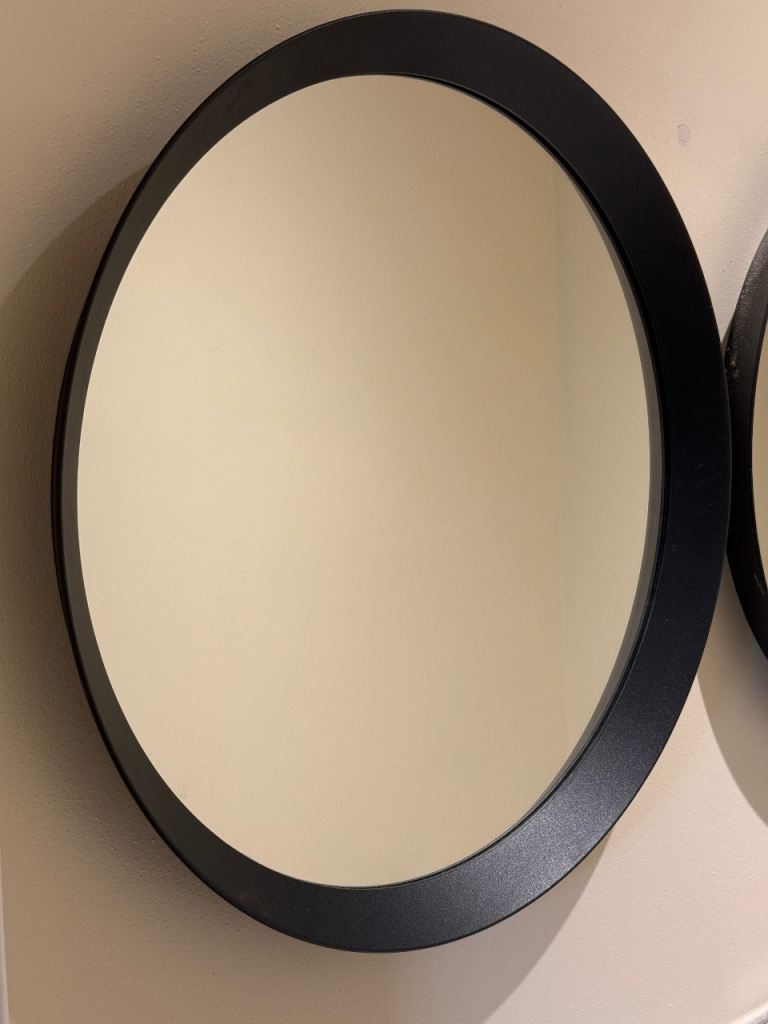 Two IKEA langesund round mirrors