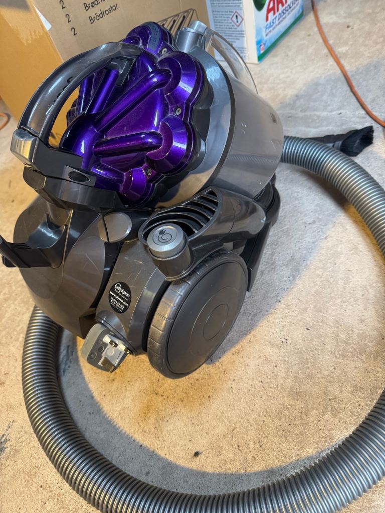 Two Dyson vacuum cleaner with accessories for spare or repair