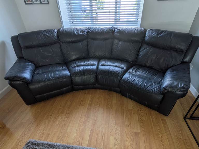 Large 4 seater black leather sofa and footstool/storage unit