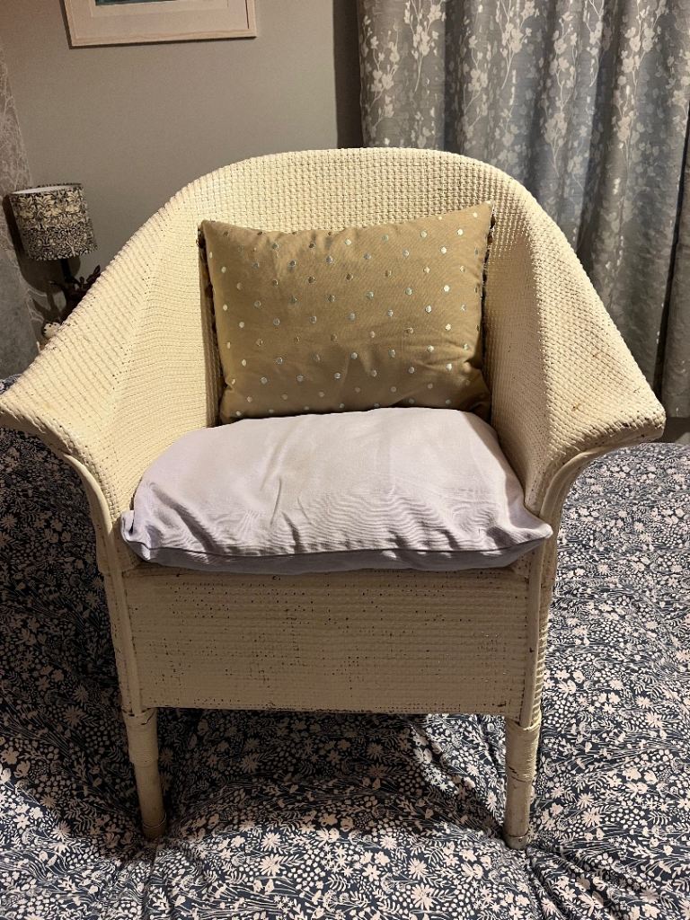 White Wicker Armchair without cushions.