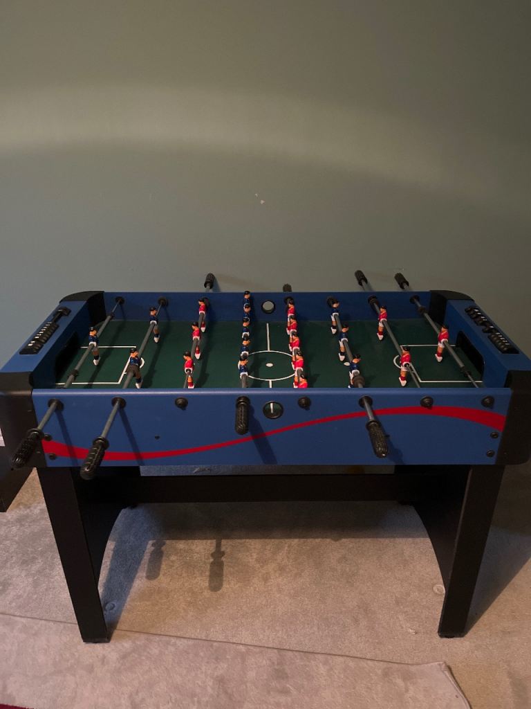 Blue, black and red foosball table