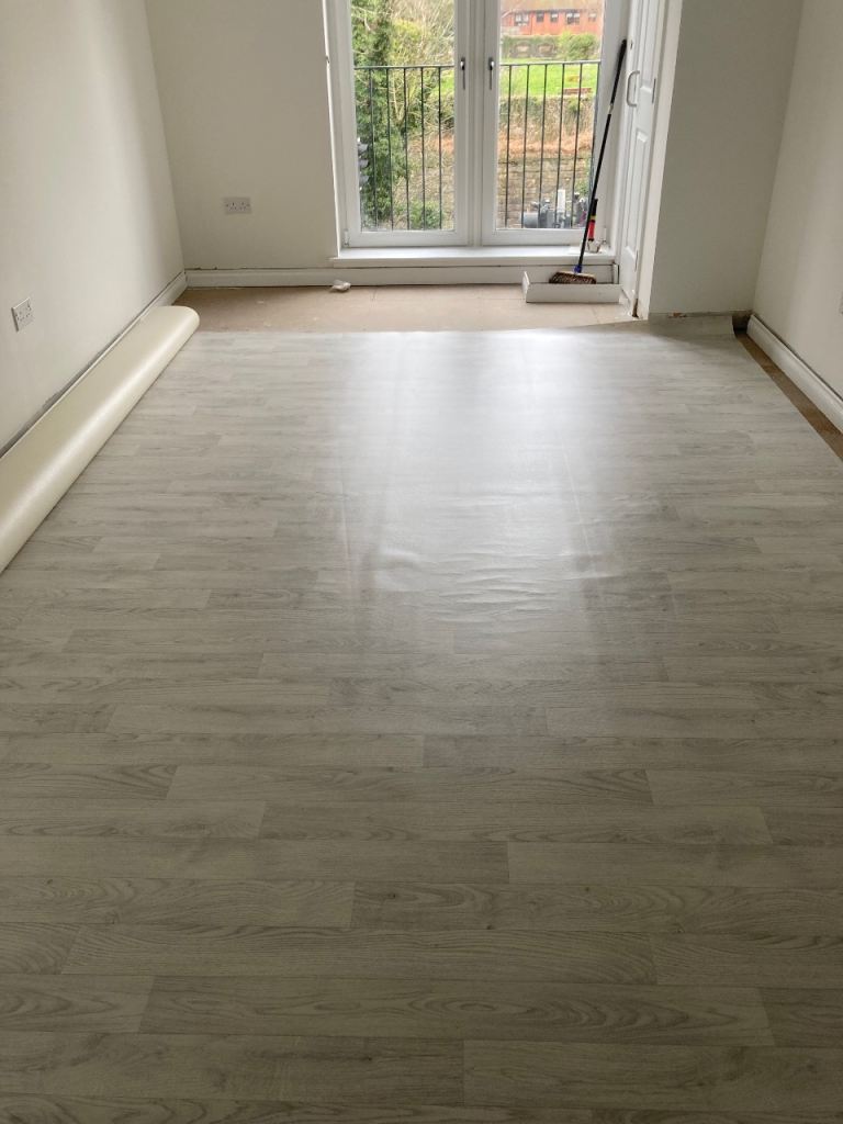Plank like grey/ white thin vinyl flooring estimate size 3x7m