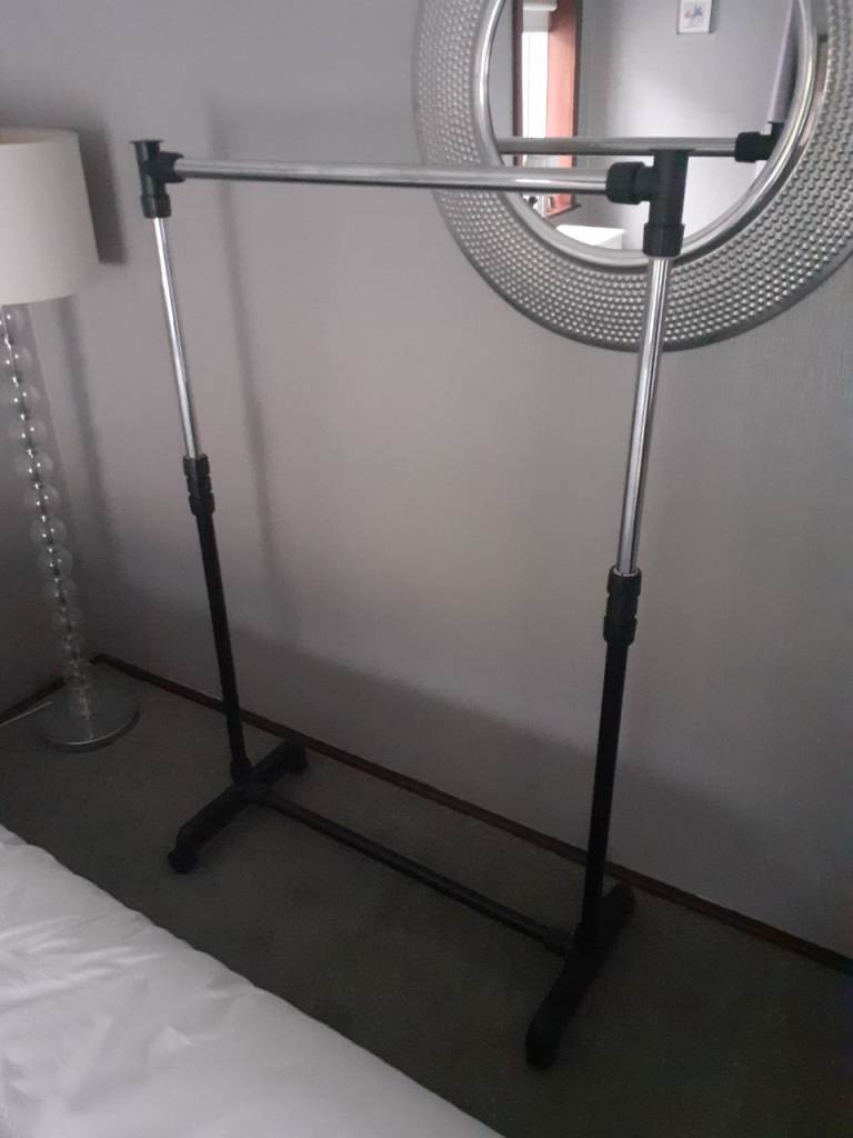 Clothes Rail. Moveable on Wheels, Height adjustable 