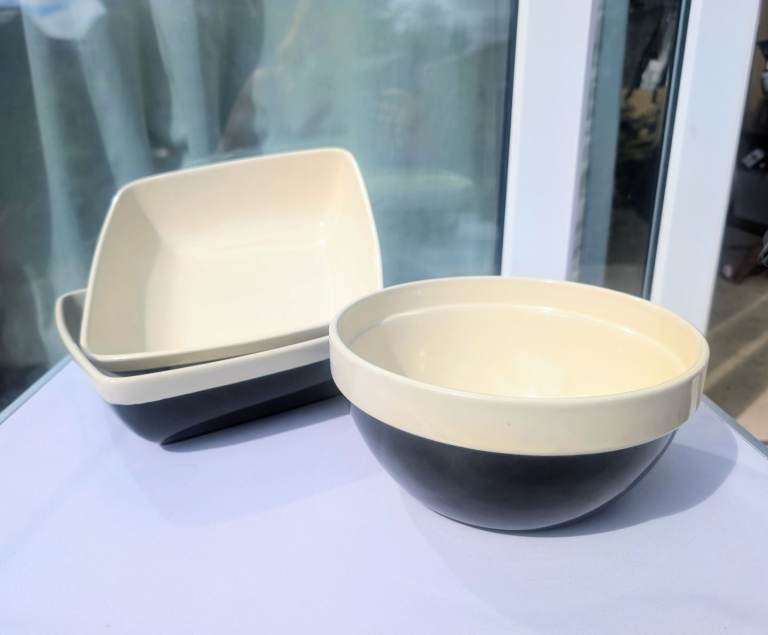 Nouvelle cuisine three ceramic stoneware traditional bowls in black-and-cream colours