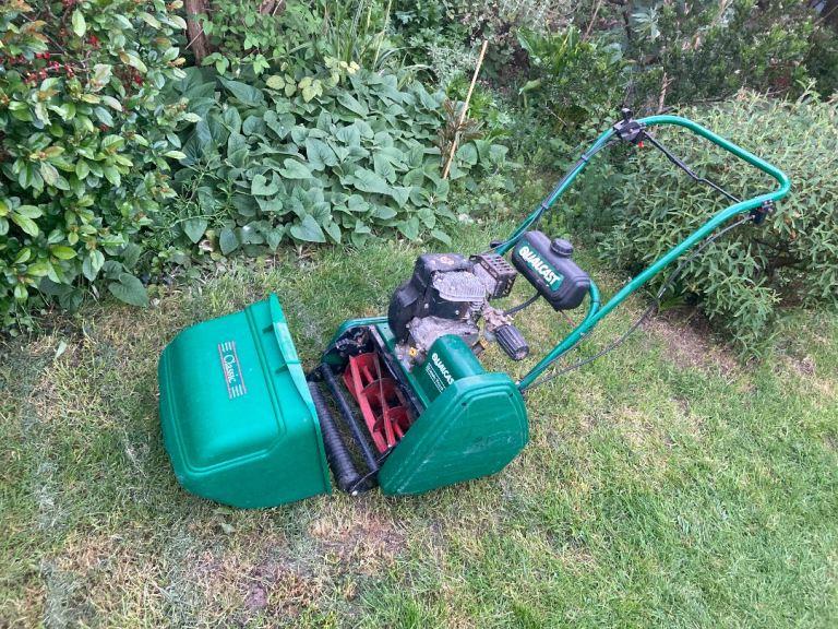 Qualcast petrol lawn mower with roller   