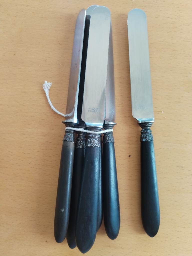Vintage French knives with ebony handles and ornate metal bolsters - set of 6