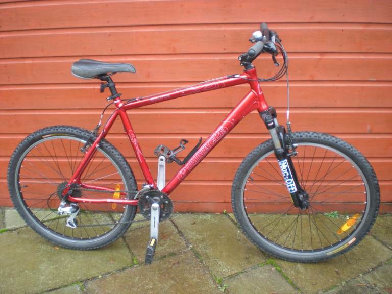 Pinnacle source bike, 21 inch lightweight frame, 26 inch wheels, 24 gears, front suspension
