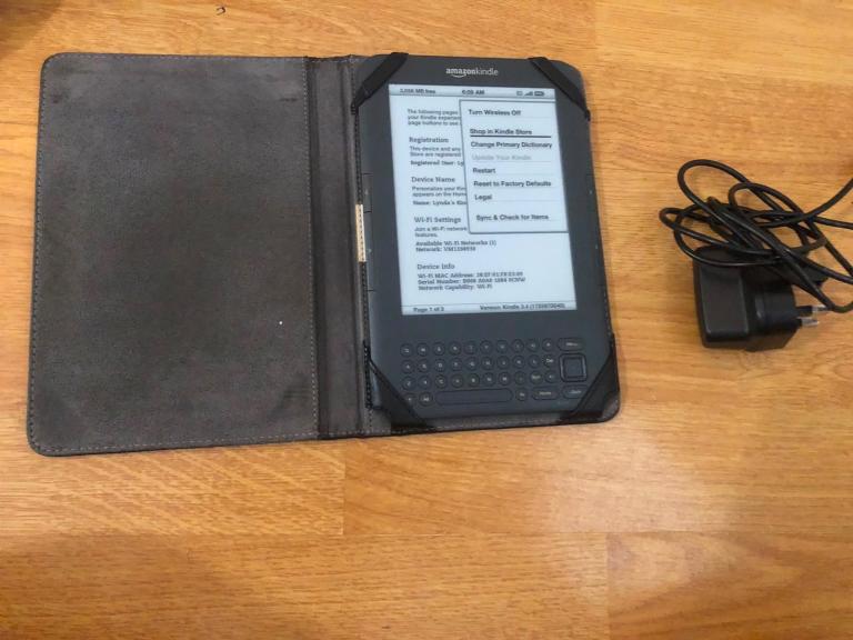 Amazon kindle reader  Good condition with protective cover and charger good working and 