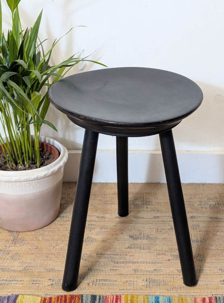 Antique three legged milking stool black 