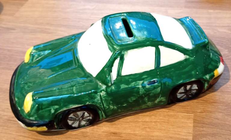 Pottery model of a Porsche 911 sports car MONEY BOX from pottery painting cafe, painted green but 