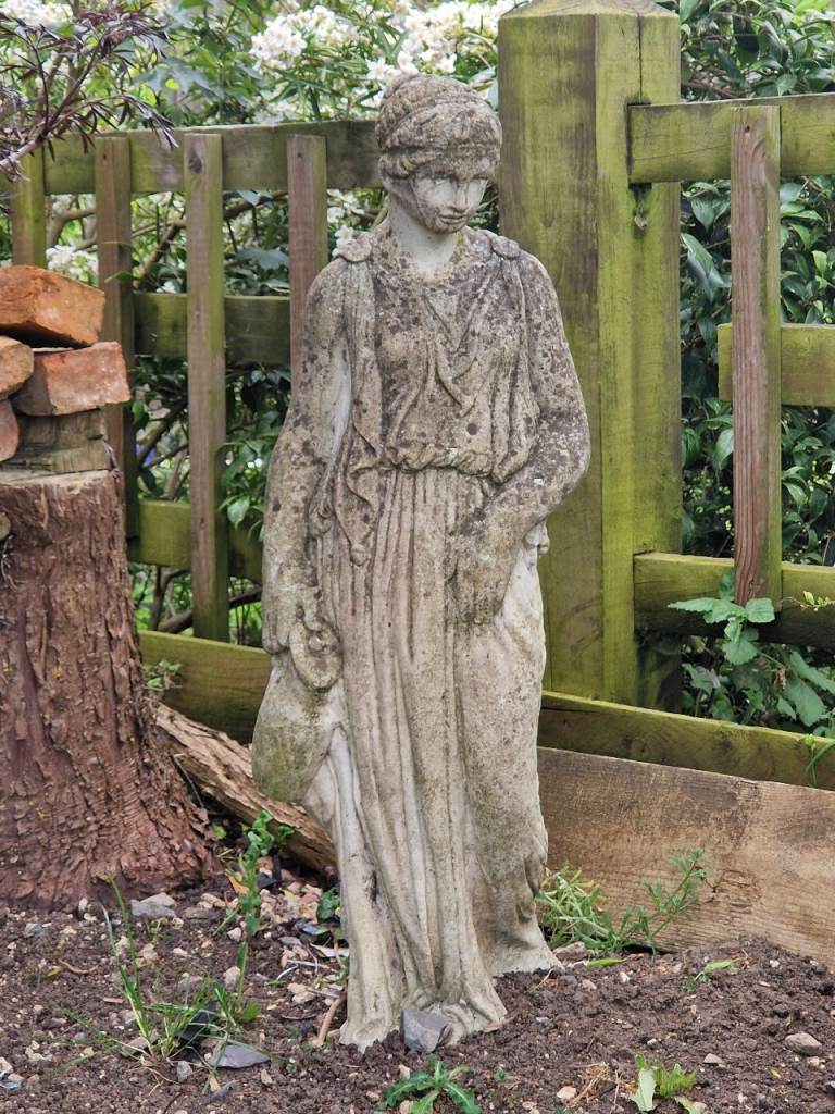 Weathered garden statue