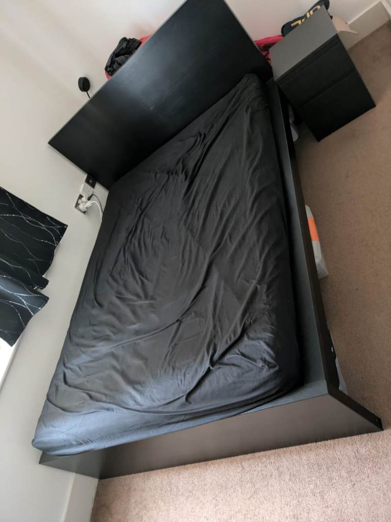 Bed with mattrass and bedside table