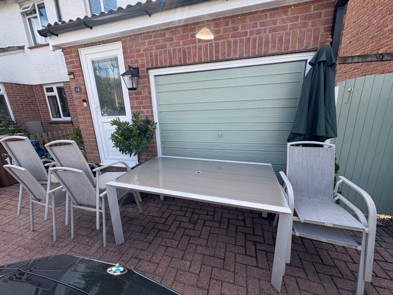 Garden table and 6 chairs open to offers 