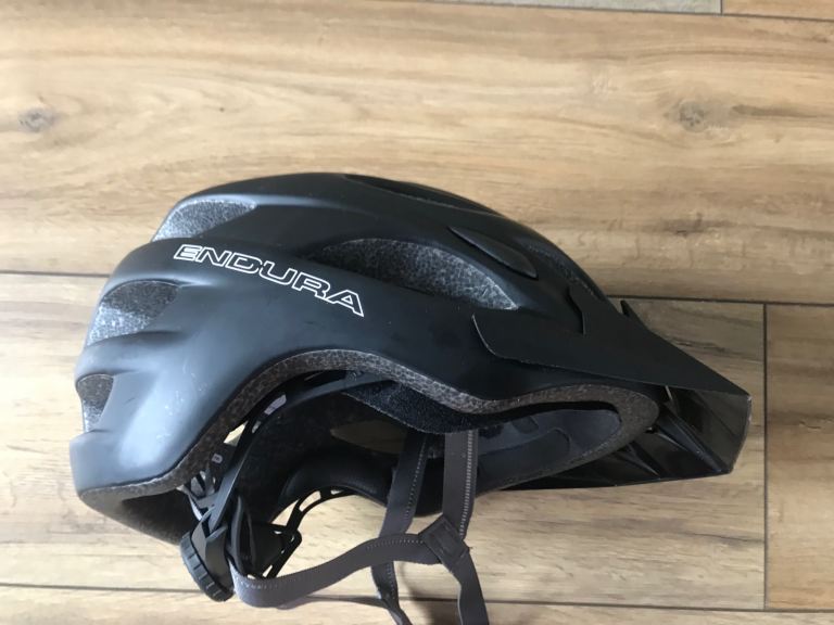 Cycle helmet pouch and bottle cage