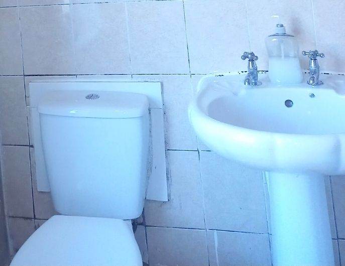 White Porcelain Bathroom Toilet and Pedestal Sink with Taps
