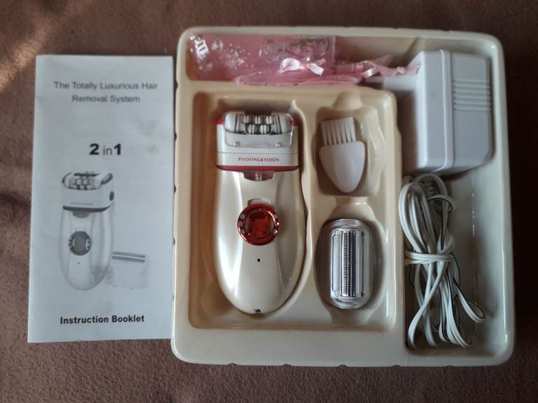 Epillator twin roller tweezers with extra shaving trimmer head.