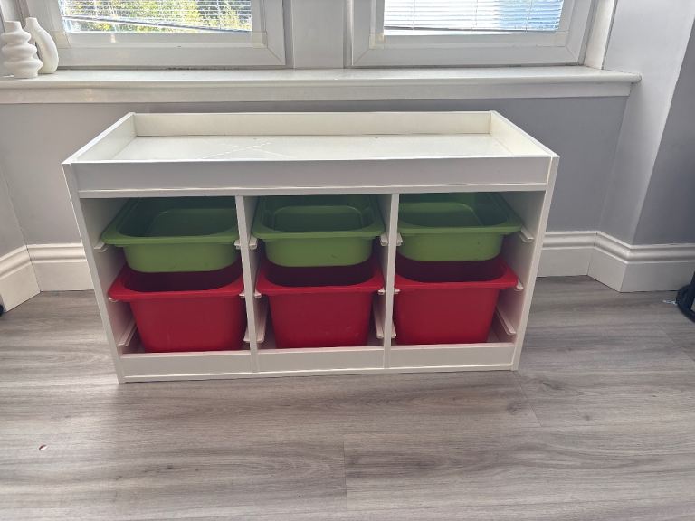 White Storage Unit with Red and Green Bins – Good Condition