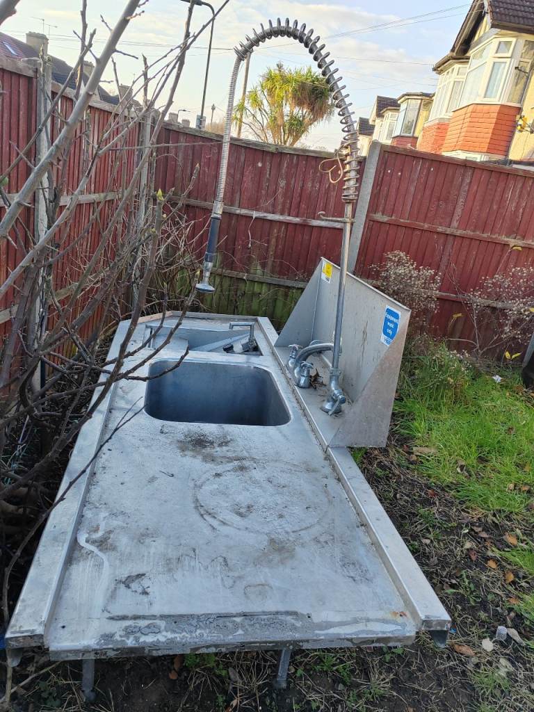 Large restaurant kitchen table with waste shredder 