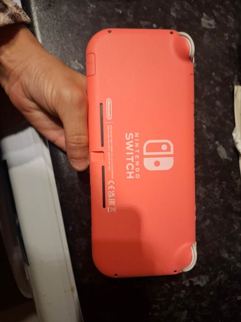 Nintendo Switch coral + 2 games,Minecraft and animal crossing +charger