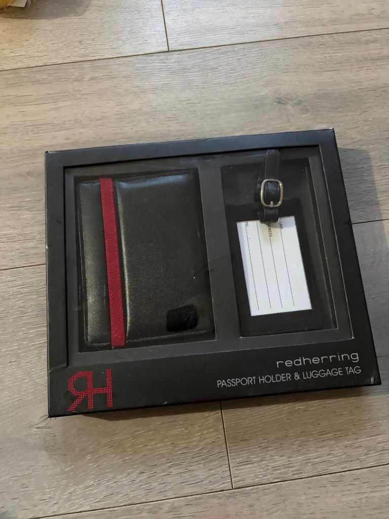 Passport holder with identification paper inside