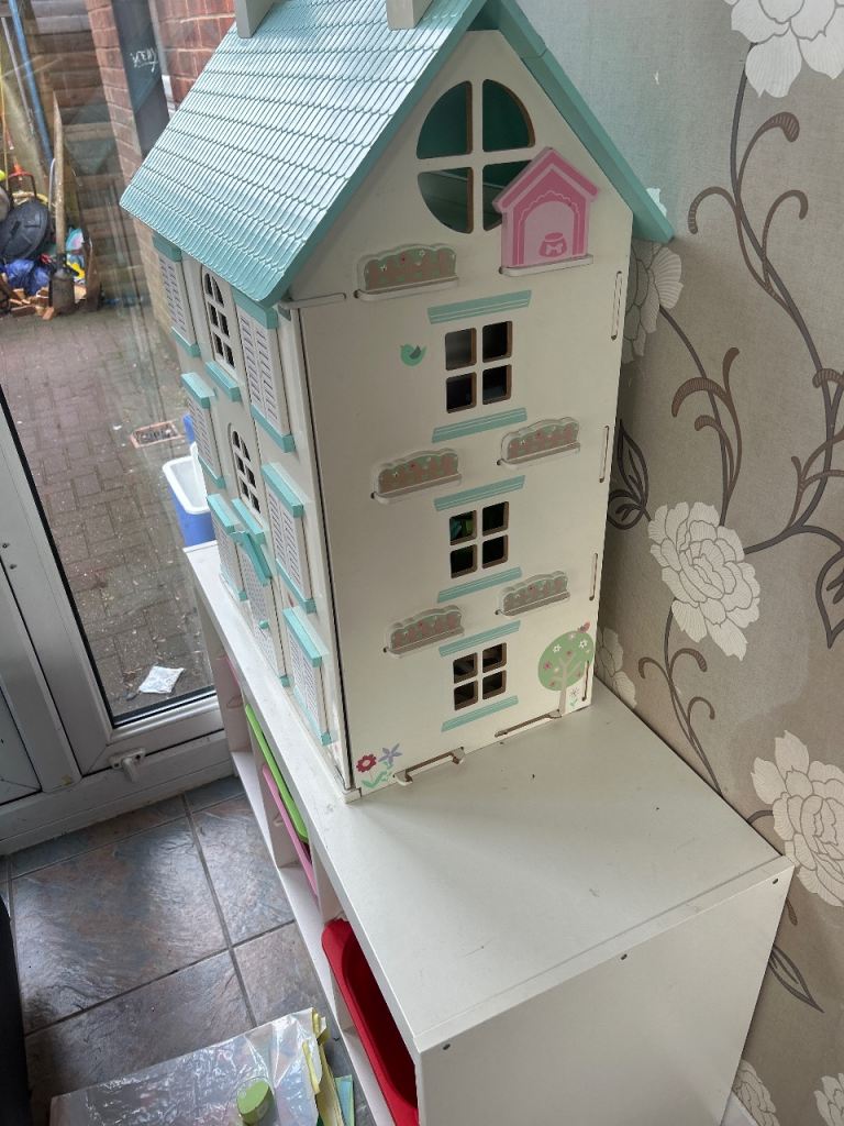 Dolls house with storage boxes 