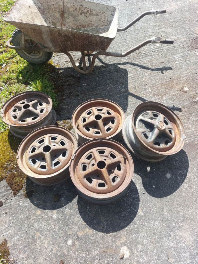 steel wheels rostyle 13 or 14" , I can go and check the exact sizes if your interested 