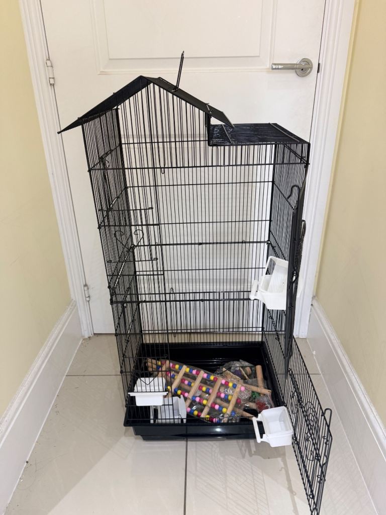 BARGAIN. BRAND NEW BLACK BIRD CAGE WITH TOYS ETC