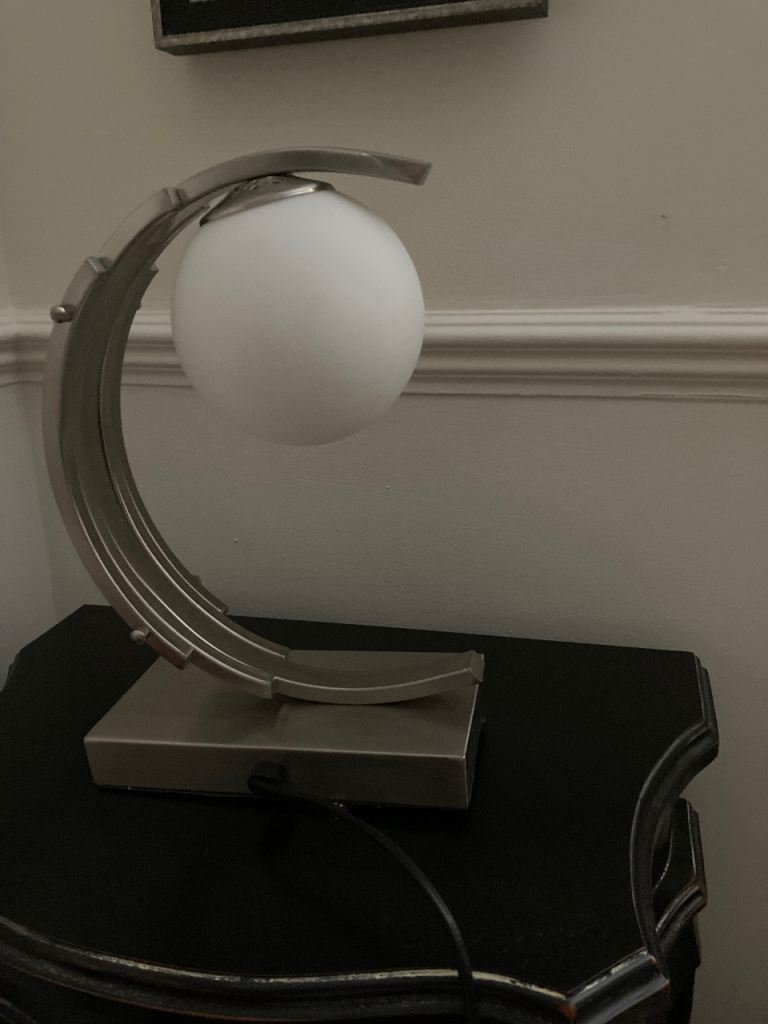 Silver Table lamp with frosted globe.