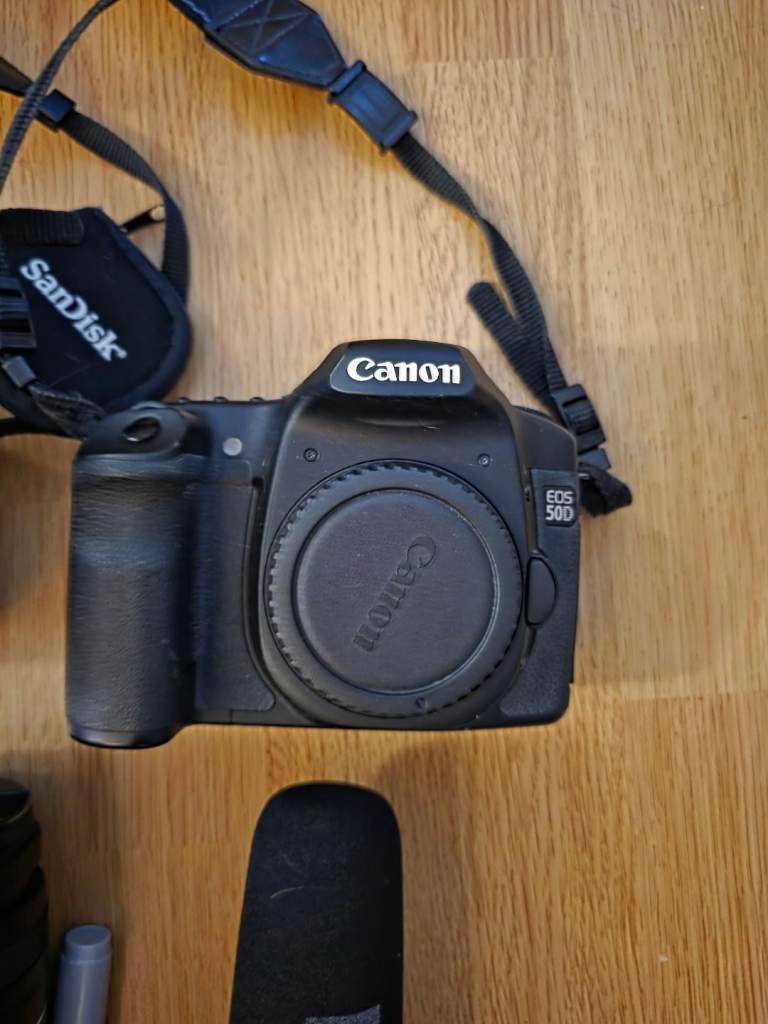 2 canon cameras with loads of accessories.