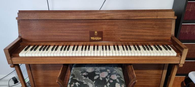 Lovely Eavestaff Pianette and stool