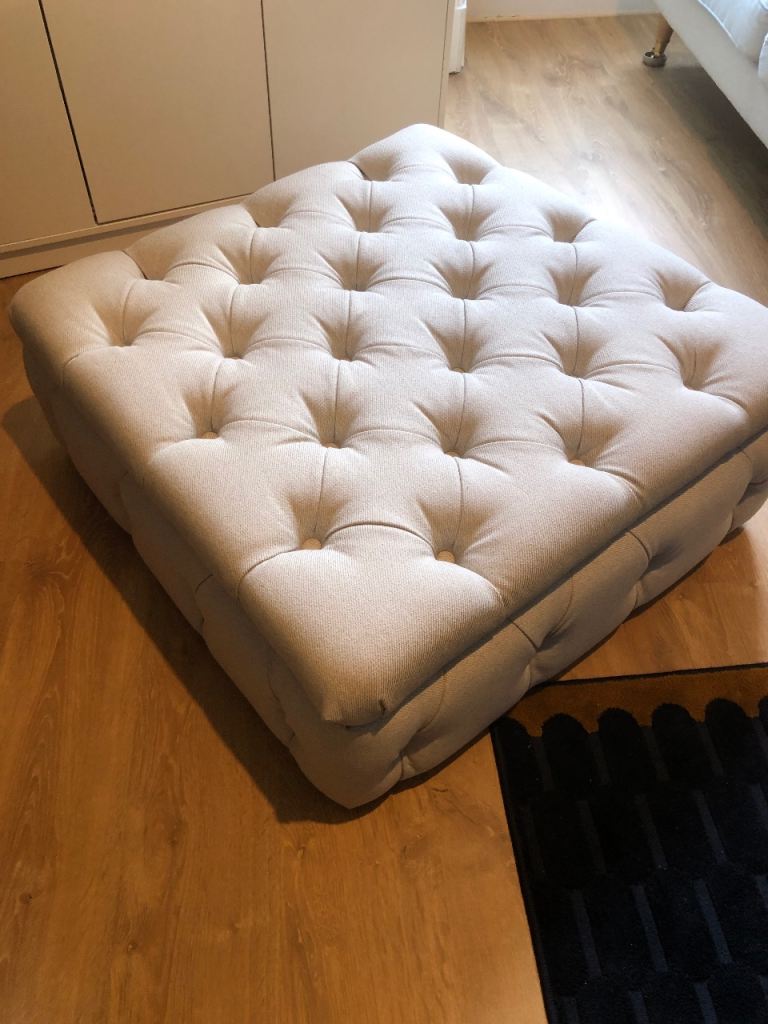 Large fabric footstool with storage