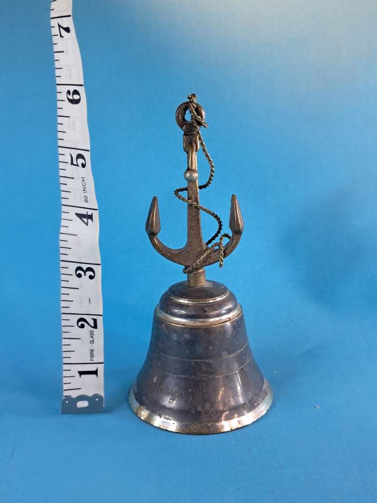 Vintage,antique brass ship's bell anchor-shaped handle and a rope lanyard.