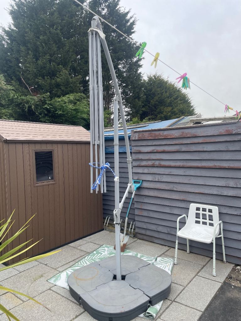 Garden umbrella with weights at bottom