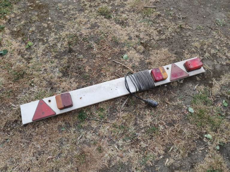 Trailer board with 7 pin plug and fog light.