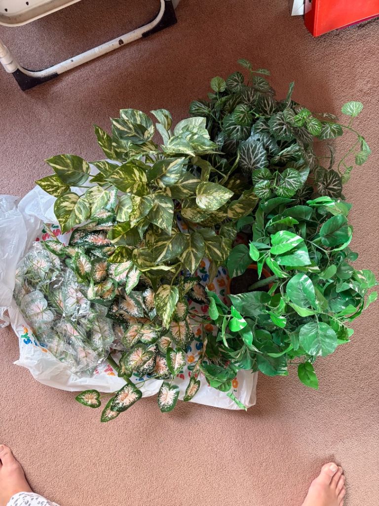 Various artificial plants and pot stands