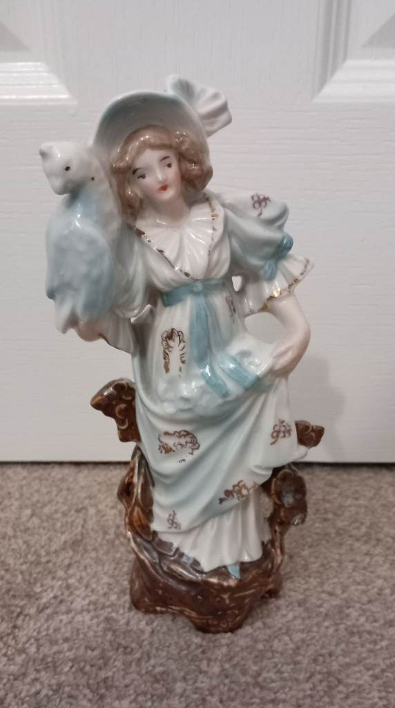 Ornament of Lady with Parrot. 8" approx high 