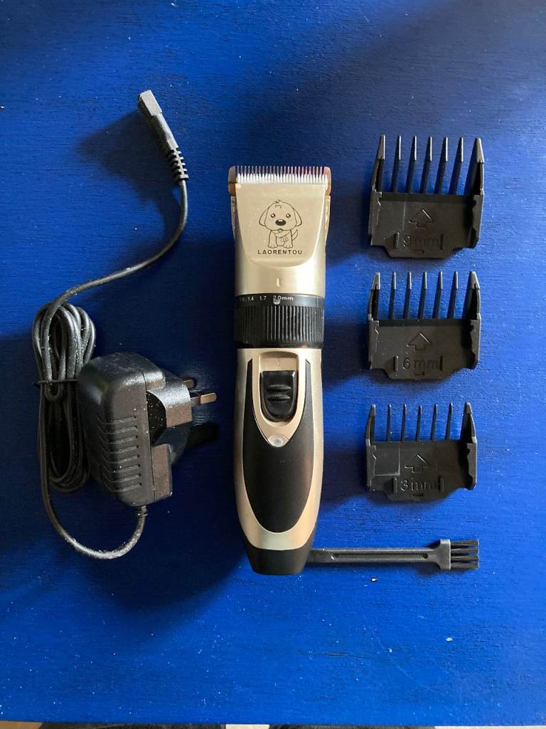 Rechargeable dog grooming clippers with adjustable head and attachments. VGC. £5