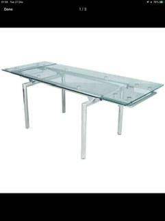 Glass extendable dining table