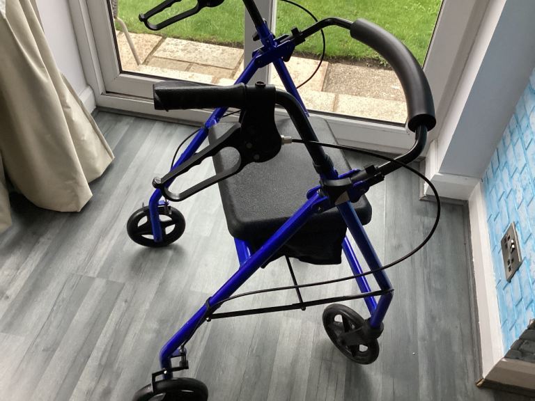 Blue Mobility Walker with Seat and Brakes – Good Condition