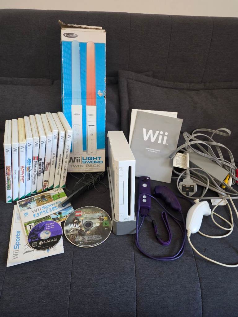Nintendo Wii with 13 games & Wii Light sword accessory and extra nunchuck