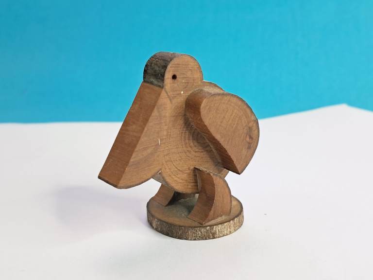 Vintage, hand-carved wooden pelican figurine