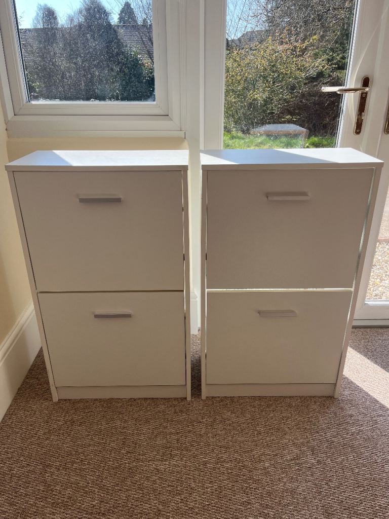 Two white shoe storage cupboards 