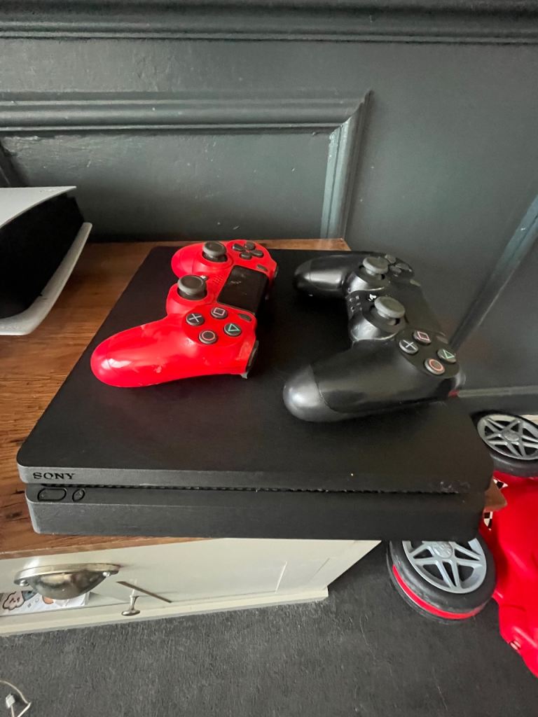 PlayStation 4 with 17 games and two controllers 