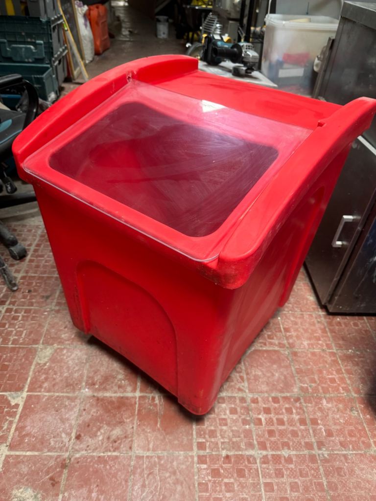 Red ingredients storage container on wheels