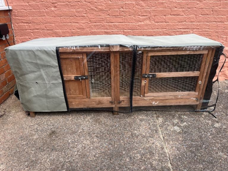 Large wooden outdoor hutch with weather-proof cover - great for guinea pigs or rabbits 